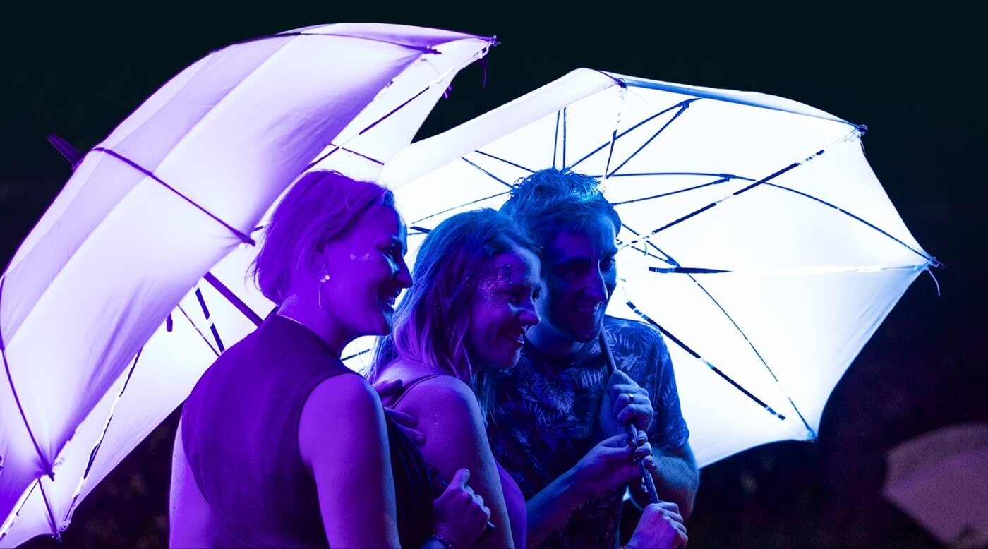 Visitors enjoying the Cirque Bijou umbrella parade